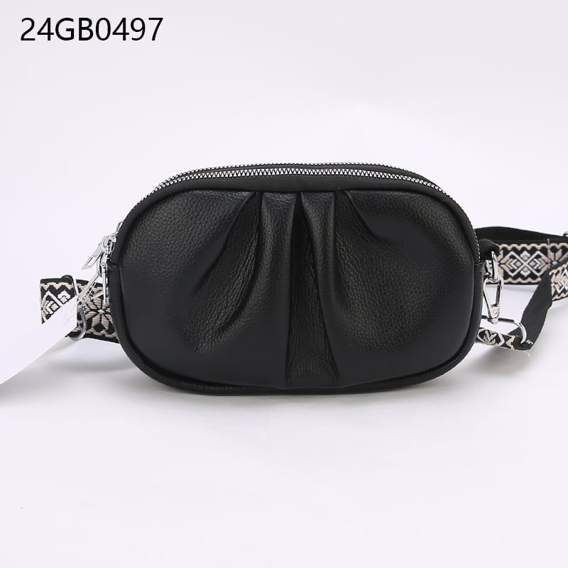 Faux leather cross body bag with patterned shoulder strap