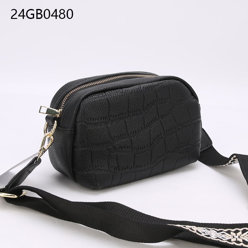 Small faux leather cross body bag with patterned shoulder strap