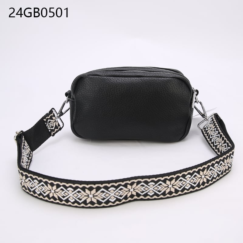 Faux leather crossbody bag with with patterned shoulder strap