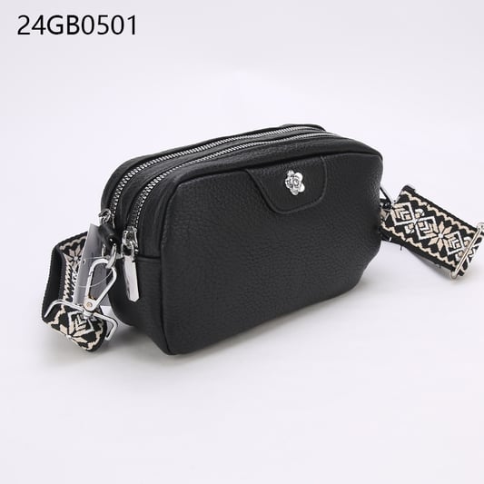 Faux leather crossbody bag with with patterned shoulder strap